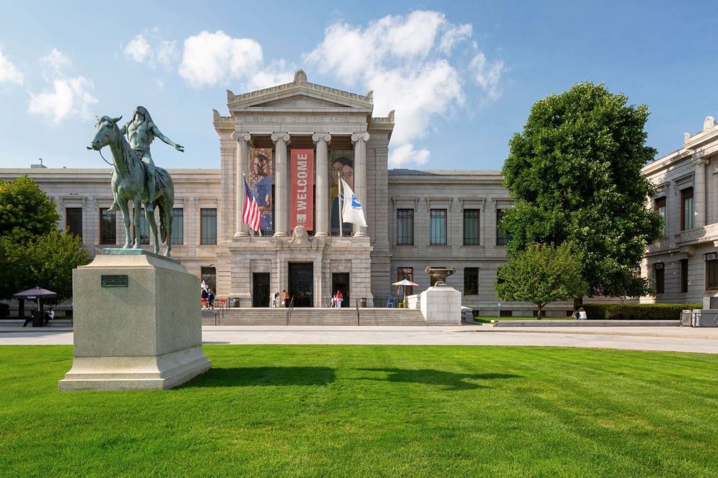 Museum of Fine Arts Boston with statue in the front lawn.